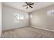 Bedroom with a ceiling fan, neutral tones, and a backyard view at 24478 N 166Th Ave, Surprise, AZ 85387