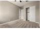 Neutral bedroom with closet, neutral paint, carpet flooring, and ceiling fan at 24478 N 166Th Ave, Surprise, AZ 85387
