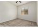 Bright bedroom with neutral carpet and a window providing natural light at 24478 N 166Th Ave, Surprise, AZ 85387