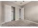 Neutral bedroom with closet, neutral paint, carpet flooring, and ceiling fan at 24478 N 166Th Ave, Surprise, AZ 85387