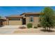 Charming single-story home featuring a well-manicured yard and a neutral color palette at 24478 N 166Th Ave, Surprise, AZ 85387
