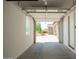 A clean garage showcases a view of the driveway, garden, and a glimpse of the neighborhood at 24478 N 166Th Ave, Surprise, AZ 85387