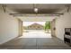 Open garage with view of the landscaped backyard at 24478 N 166Th Ave, Surprise, AZ 85387