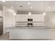 Kitchen island with granite countertops and stainless steel appliances at 24478 N 166Th Ave, Surprise, AZ 85387