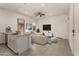 Bright, open-concept living space with a modern kitchen island and comfortable seating at 24478 N 166Th Ave, Surprise, AZ 85387
