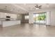 Large, open living area with tile flooring, an eat-in kitchen and plenty of natural light at 24478 N 166Th Ave, Surprise, AZ 85387