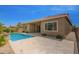 Backyard pool with covered patio and desert landscaping at 24478 N 166Th Ave, Surprise, AZ 85387
