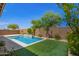 Backyard pool with artificial turf and desert landscaping at 24478 N 166Th Ave, Surprise, AZ 85387