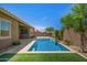 Backyard pool with stone patio and desert landscaping at 24478 N 166Th Ave, Surprise, AZ 85387