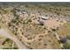 Home with desert surroundings, showing land size and proximity to a paved road and adjacent properties at 270 S Ralston Rd, Maricopa, AZ 85139