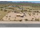 An aerial view shows the home's large lot and privacy in the desert landscape at 270 S Ralston Rd, Maricopa, AZ 85139