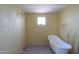 Bathroom featuring a claw foot bathtub, new flooring and fixtures at 270 S Ralston Rd, Maricopa, AZ 85139