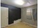 Bedroom with dark accent wall and single window at 270 S Ralston Rd, Maricopa, AZ 85139