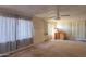 Spacious living room featuring a ceiling fan, blinds and a large window at 270 S Ralston Rd, Maricopa, AZ 85139