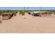 Desert property with outbuilding and minimal landscaping offering tranquility and vast open spaces at 270 S Ralston Rd, Maricopa, AZ 85139