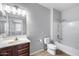 Well-lit bathroom with a vanity, mirror, toilet, and shower-tub combination, creating a functional space at 2941 E Darrow St, Phoenix, AZ 85042