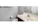 Bright half bathroom with white sink, dark cabinets, and modern fixtures, showcasing a clean and functional space at 2941 E Darrow St, Phoenix, AZ 85042