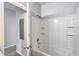 Well-lit full bathroom featuring a tiled shower-tub combo, providing a comfortable and modern bathing experience at 2941 E Darrow St, Phoenix, AZ 85042
