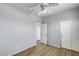 Bedroom with wood-look flooring, ceiling fan, and closet at 2941 E Darrow St, Phoenix, AZ 85042