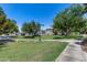 Green lawn in a community park with mature trees and walking paths in a well maintained HOA at 2941 E Darrow St, Phoenix, AZ 85042