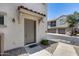 Townhome entrance featuring a covered entryway and neutral stucco exterior with well maintained landscaping at 2941 E Darrow St, Phoenix, AZ 85042