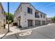 Modern townhome featuring a private balcony, a two-car garage, and neutral stucco exterior at 2941 E Darrow St, Phoenix, AZ 85042