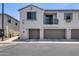 Modern townhome featuring a private balcony, a two-car garage, and neutral stucco exterior at 2941 E Darrow St, Phoenix, AZ 85042
