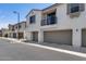 Modern townhome featuring a private balcony, a two-car garage, and neutral stucco exterior at 2941 E Darrow St, Phoenix, AZ 85042