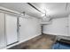 Spacious garage interior with a white door and visible garage door opener system at 2941 E Darrow St, Phoenix, AZ 85042