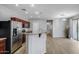 Modern kitchen boasts stainless steel appliances, granite countertops, and dark wood cabinets at 2941 E Darrow St, Phoenix, AZ 85042