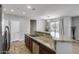 An open kitchen layout includes granite countertops and stainless steel appliances at 2941 E Darrow St, Phoenix, AZ 85042