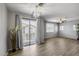 A bright living room with sliding glass doors, a ceiling fan, and wood-look tile flooring at 2941 E Darrow St, Phoenix, AZ 85042