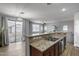 A open concept living space featuring granite countertops, a sink, and a sliding door at 2941 E Darrow St, Phoenix, AZ 85042