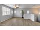 Bright living room with hardwood floors, multiple windows, and a ceiling fan at 2941 E Darrow St, Phoenix, AZ 85042