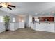 Open-concept living space featuring hardwood floors and a view of the kitchen at 2941 E Darrow St, Phoenix, AZ 85042