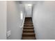 Carpeted staircase leading upstairs with a window providing natural light at 2941 E Darrow St, Phoenix, AZ 85042