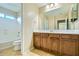 Bathroom featuring a shower, tub, and dual sink vanity at 29828 N 72Nd Ln, Peoria, AZ 85383