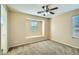 Bedroom with plush carpeting and sunlit windows at 29828 N 72Nd Ln, Peoria, AZ 85383