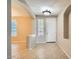 Foyer featuring tile floors, neutral walls, arched doorways, and a front door with a window at 29828 N 72Nd Ln, Peoria, AZ 85383