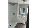 Clean bathroom showcasing a walk-in shower and a white vanity with a framed mirror at 300 S Val Vista Dr # 17, Mesa, AZ 85204
