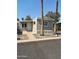 Charming single-story home with a well-maintained yard and mature palm trees, creating a welcoming curb appeal at 300 S Val Vista Dr # 17, Mesa, AZ 85204