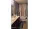 The bathroom features a double vanity and large mirror at 31138 N 130Th Ln, Peoria, AZ 85383