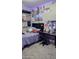 Bedroom featuring a comfortable bed, desk, and personalized décor at 31138 N 130Th Ln, Peoria, AZ 85383