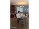 Bright dining area with ample seating next to the kitchen, and decorative chandelier at 31138 N 130Th Ln, Peoria, AZ 85383