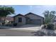 Inviting single-story home featuring desert landscaping, stone accents, and a two-car garage at 31138 N 130Th Ln, Peoria, AZ 85383