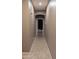 Hallway with tile flooring leading to a bedroom or living area, offering a glimpse into the home's layout at 31138 N 130Th Ln, Peoria, AZ 85383