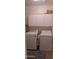 Well-equipped laundry room with side-by-side washer and dryer and ample storage space at 31138 N 130Th Ln, Peoria, AZ 85383