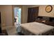 Spacious main bedroom with a comfortable bed, access to the bathroom, and ample natural light at 31138 N 130Th Ln, Peoria, AZ 85383