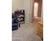 The office has a cozy chair and view of the bathroom at 31138 N 130Th Ln, Peoria, AZ 85383