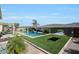 The backyard features a pool, mature landscaping, and a lounge area at 3125 W Desert Ln, Laveen, AZ 85339